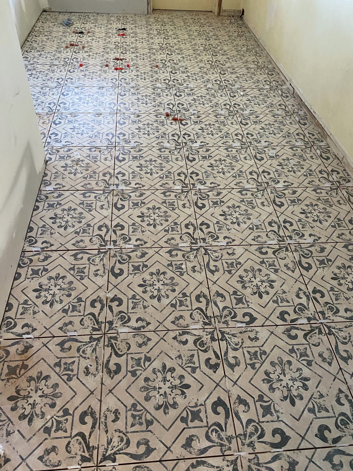 Newly installed patterned tile floor